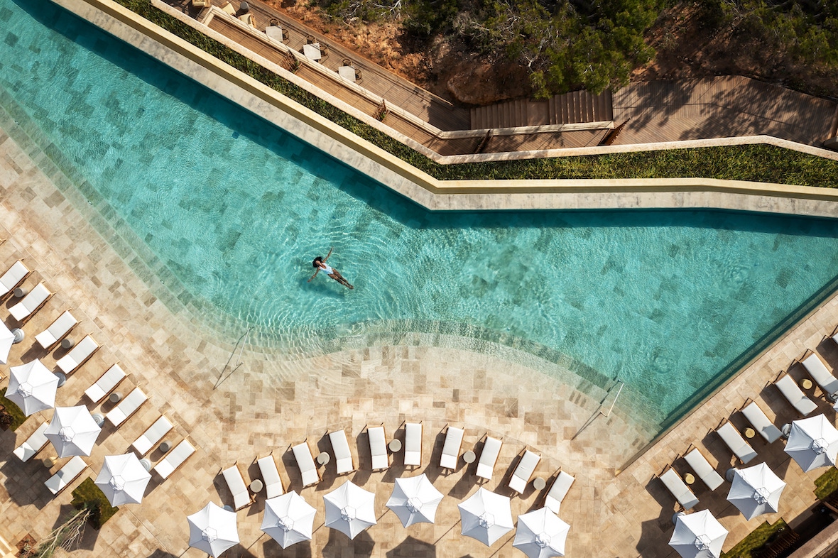 Six Senses - woman-floating-in-pool